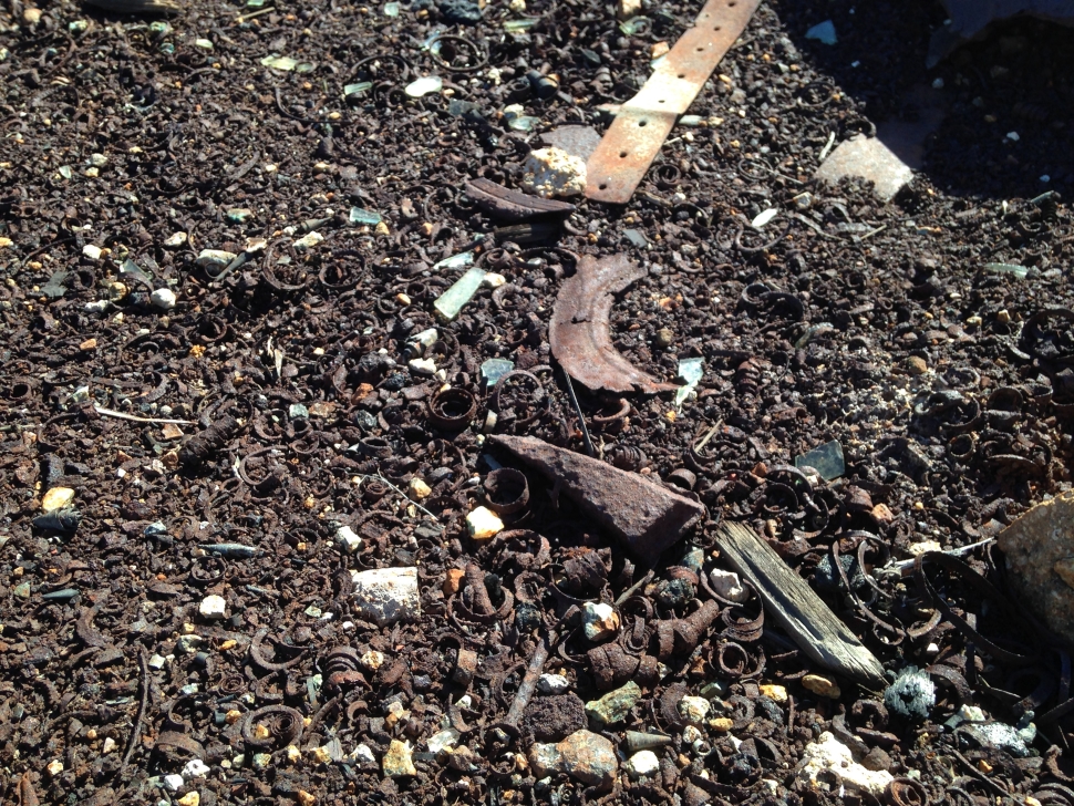 Fragments of metal bits in the soil